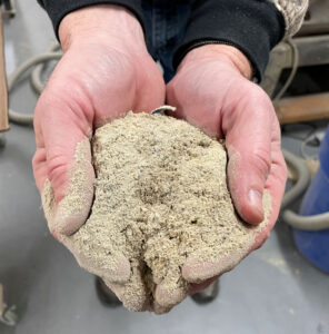 Handful of sawdust before dust collection